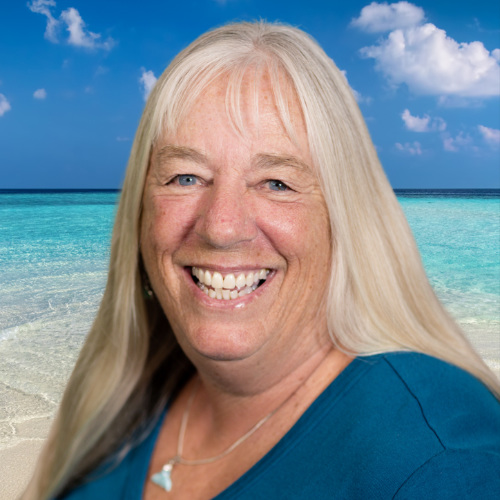 Woman with long blond hair smiling.