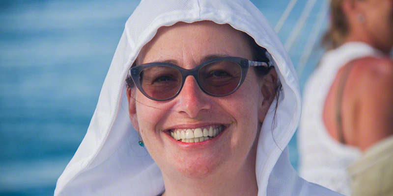 woman with white hood smiling