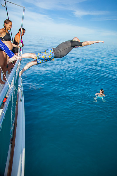 Rob Israel jumping into the ocean